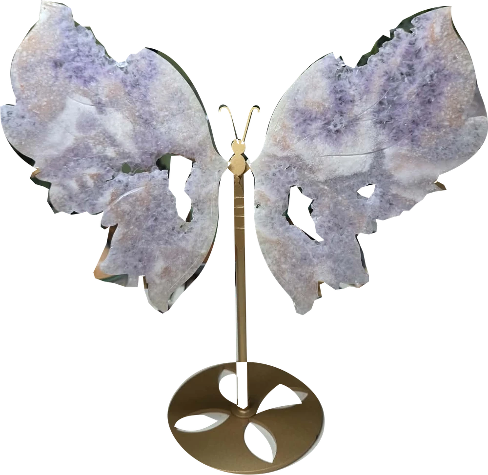 Ann’s amethyst butterfly carving in pale lavender tones on its original gold-colored stand.